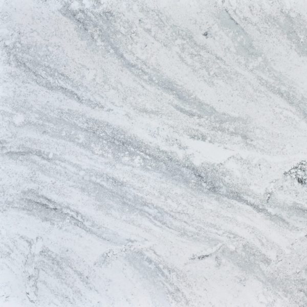Premium engineered stone surface with natural marble-like veining, ideal for modern interiors and benchtop applications.